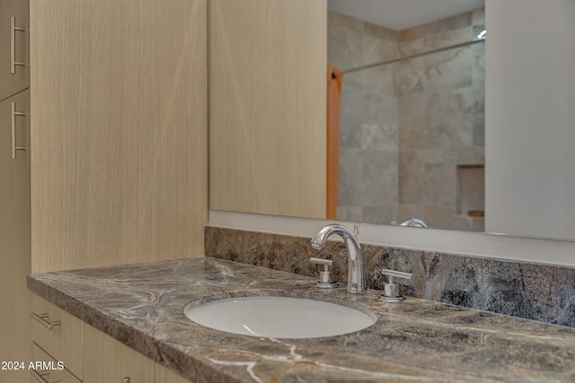 bathroom with vanity and walk in shower