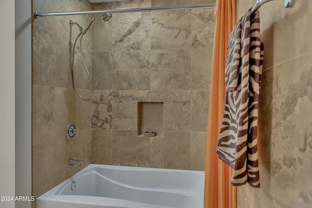 bathroom with shower / bathtub combination with curtain