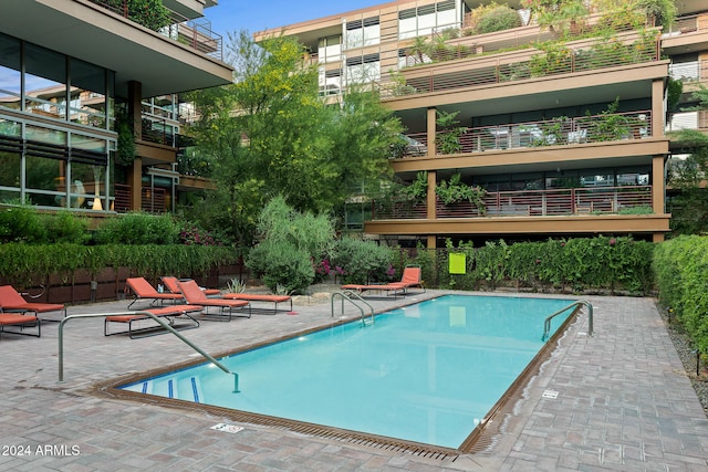 view of swimming pool featuring a patio area