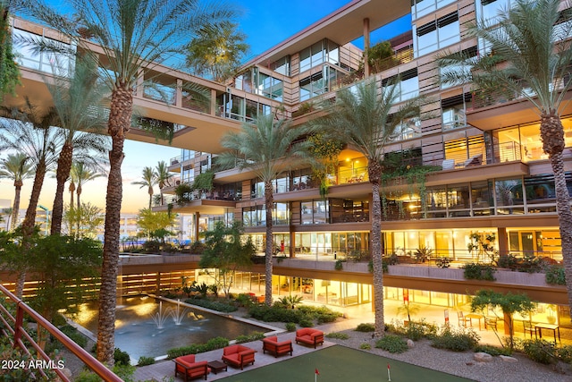 view of outdoor building at dusk