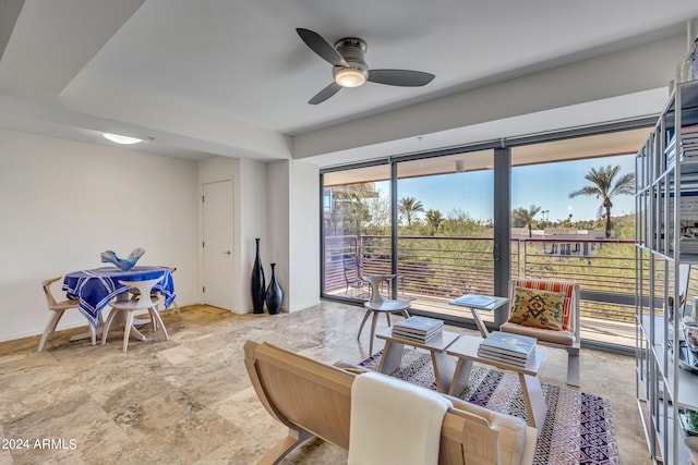 interior space with ceiling fan