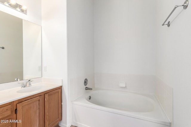 full bathroom featuring vanity and a garden tub