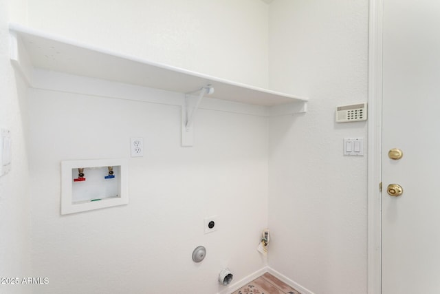 washroom featuring washer hookup, hookup for an electric dryer, laundry area, baseboards, and gas dryer hookup