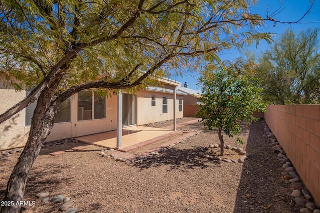 view of yard featuring a patio and a fenced backyard
