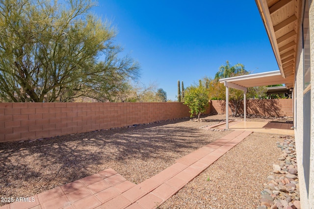 view of yard with a fenced backyard and a patio area