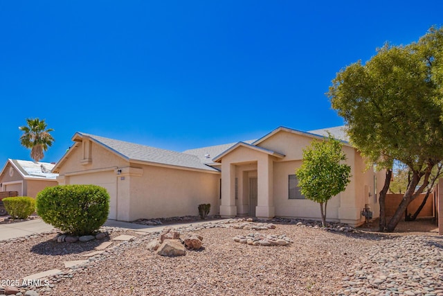 view of front of property with stucco siding and an attached garage