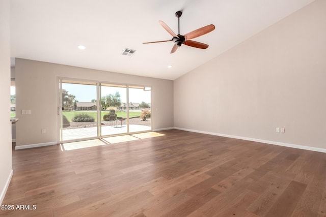 unfurnished room featuring vaulted ceiling, baseboards, and wood finished floors