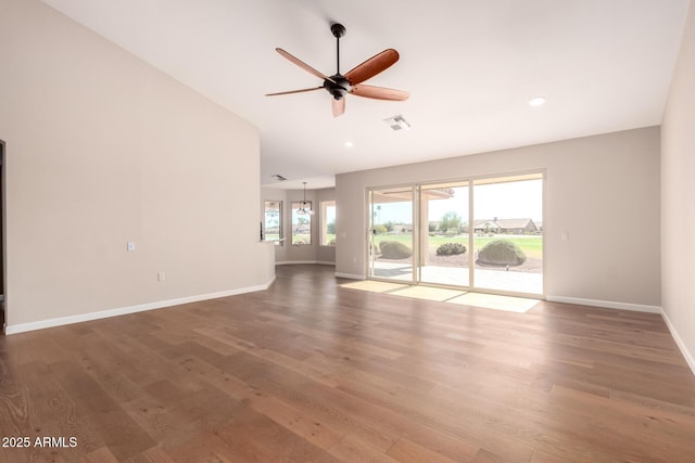 unfurnished living room with recessed lighting, wood finished floors, a ceiling fan, visible vents, and baseboards