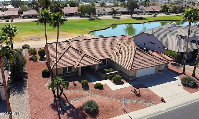 bird's eye view with a water view, a residential view, and golf course view