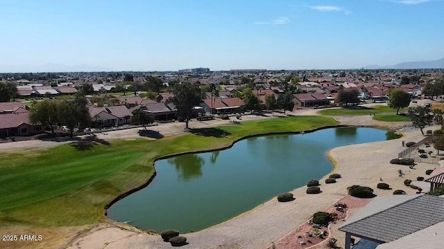 drone / aerial view with a residential view, a water view, and golf course view