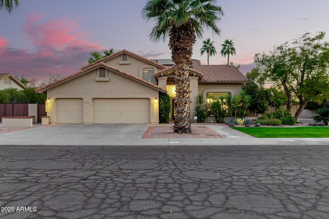 mediterranean / spanish-style home featuring a garage