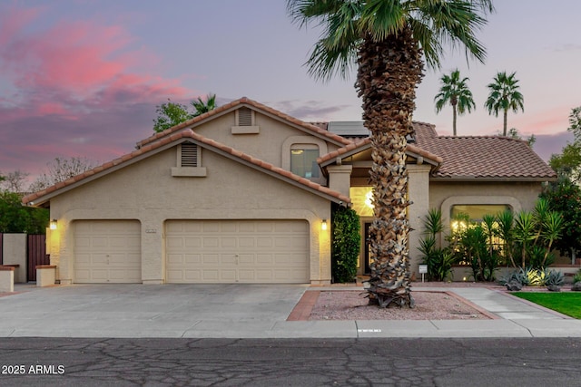 view of front of home with a garage