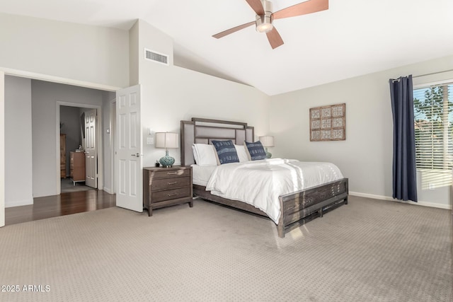 bedroom with ceiling fan, carpet floors, and vaulted ceiling