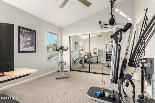 workout area with ceiling fan, vaulted ceiling, and carpet