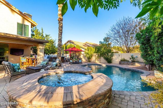 view of pool featuring an in ground hot tub, outdoor lounge area, and a patio area