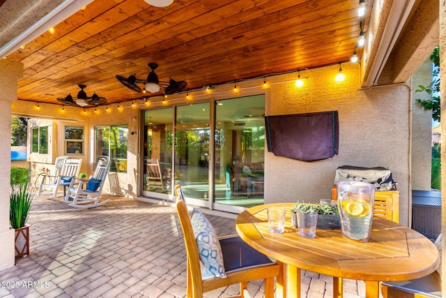 view of patio / terrace featuring ceiling fan