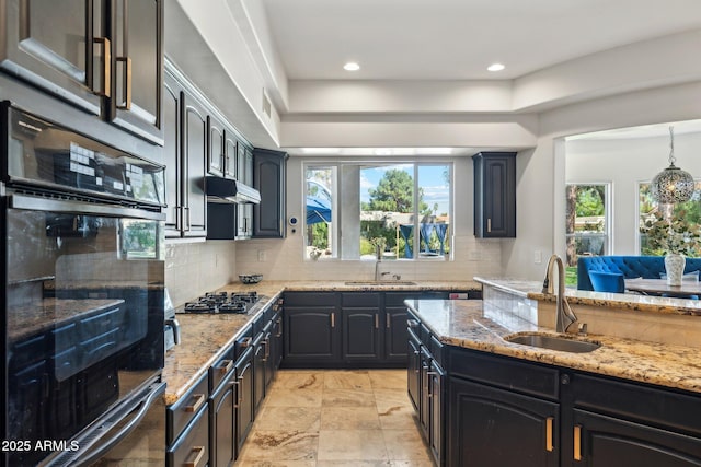 7214 E Royal Palm Rd, Scottsdale, AZ 85258 - kitchen with a sink, light stone countertops, tasteful backsplash, double oven, and recessed lighting