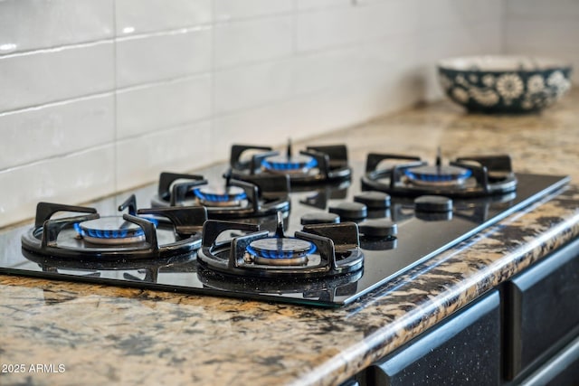 7214 E Royal Palm Rd, Scottsdale, AZ 85258 - kitchen view of tasteful backsplash and black gas stovetop