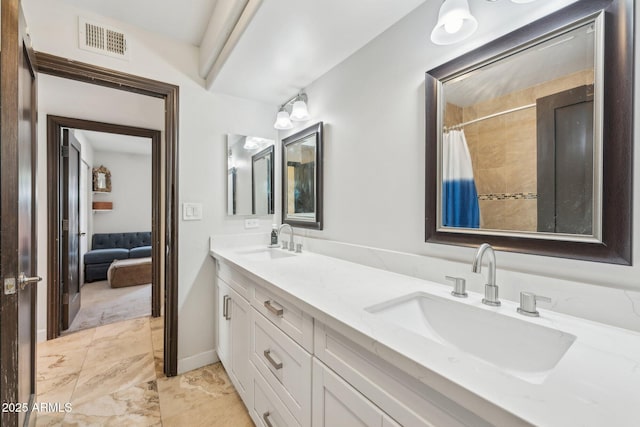 7214 E Royal Palm Rd, Scottsdale, AZ 85258 - ensuite bathroom featuring double vanity, marble look tiles, and curtained shower