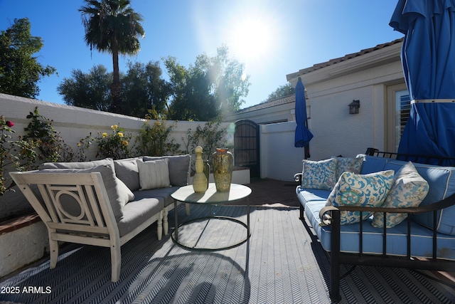 7214 E Royal Palm Rd, Scottsdale, AZ 85258 - wooden deck featuring an outdoor hangout area and a fenced backyard