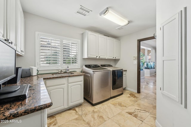 7214 E Royal Palm Rd, Scottsdale, AZ 85258 - laundry area with washing machine and clothes dryer and cabinet space