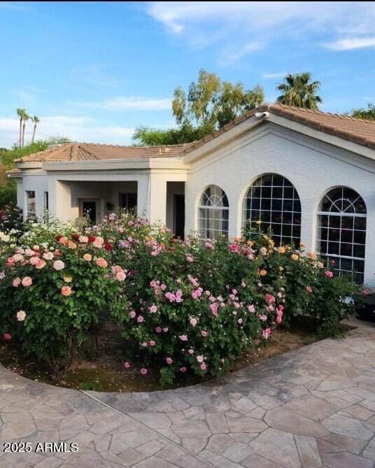 7214 E Royal Palm Rd, Scottsdale, AZ 85258 - view of property exterior featuring a tile roof