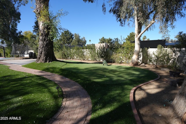 7214 E Royal Palm Rd, Scottsdale, AZ 85258 - view of property's community with a trampoline and a yard