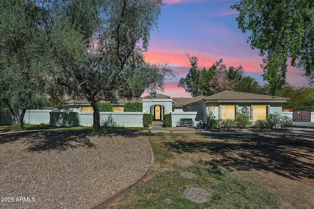 7214 E Royal Palm Rd, Scottsdale, AZ 85258 - view of front of house with a tiled roof and stucco siding