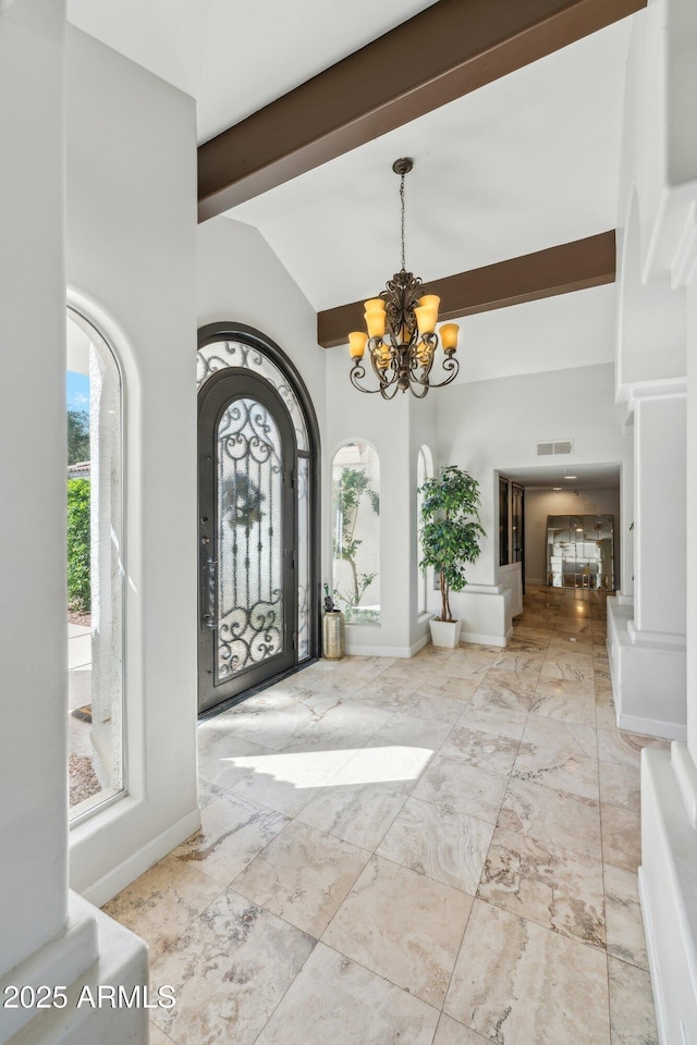 7214 E Royal Palm Rd, Scottsdale, AZ 85258 - foyer entrance featuring a chandelier, high vaulted ceiling, marble finish floors, arched walkways, and baseboards