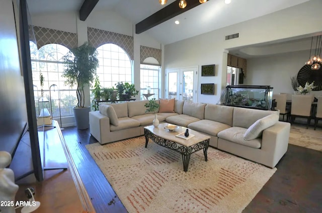 7214 E Royal Palm Rd, Scottsdale, AZ 85258 - living room with beam ceiling, healthy amount of natural light, french doors, high vaulted ceiling, and wood finished floors