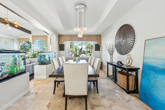 7214 E Royal Palm Rd, Scottsdale, AZ 85258 - dining area featuring a tray ceiling and baseboards