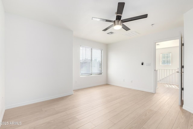 unfurnished room featuring ceiling fan and light wood-type flooring