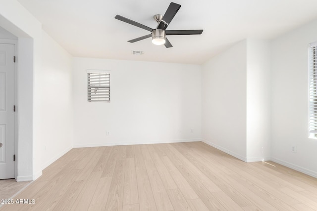 unfurnished room with ceiling fan and light hardwood / wood-style flooring