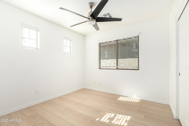 empty room featuring light hardwood / wood-style flooring and ceiling fan