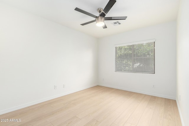 empty room featuring ceiling fan and light hardwood / wood-style flooring