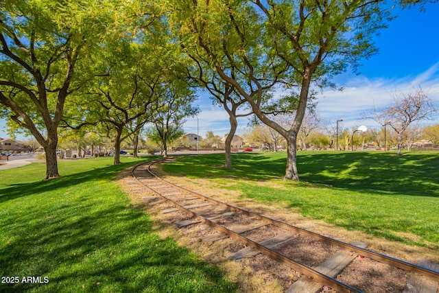 view of property's community featuring a yard