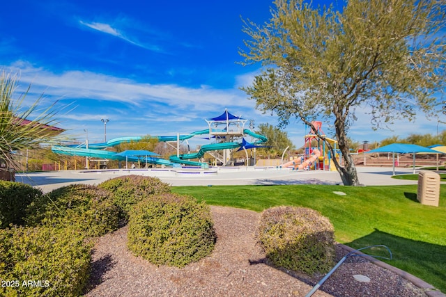 view of playground featuring a lawn