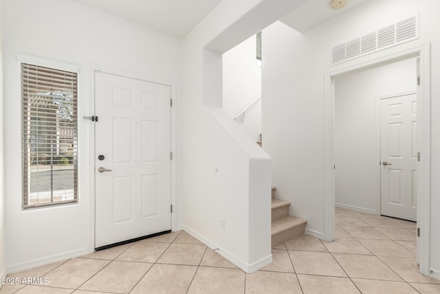 entrance foyer featuring light tile patterned floors