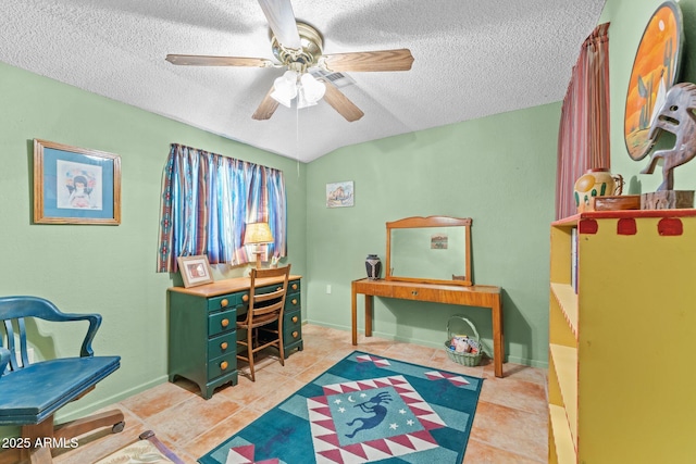 office with a textured ceiling, a ceiling fan, tile patterned floors, and baseboards