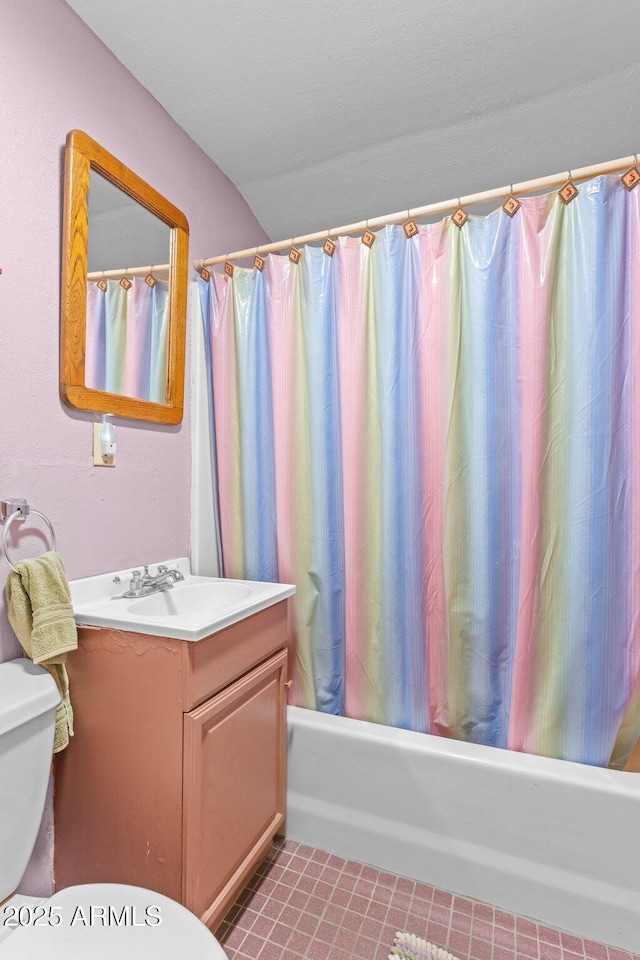 bathroom with shower / bath combo, vanity, toilet, and tile patterned flooring
