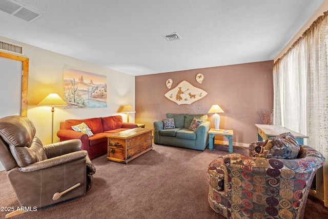 carpeted living area featuring visible vents