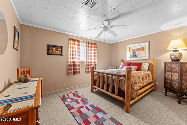 bedroom featuring baseboards, visible vents, ceiling fan, and carpet