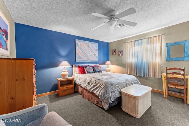 carpeted bedroom featuring a textured ceiling, visible vents, a ceiling fan, and baseboards