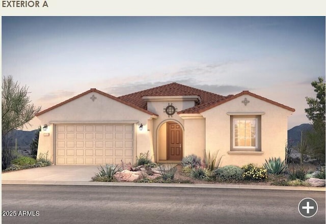 mediterranean / spanish-style house with concrete driveway, an attached garage, a tiled roof, and stucco siding