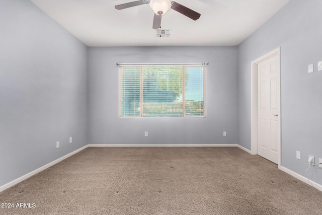 spare room with carpet flooring and ceiling fan