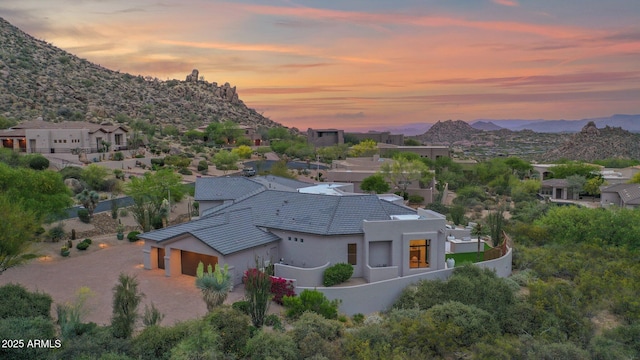aerial view at dusk with a mountain view