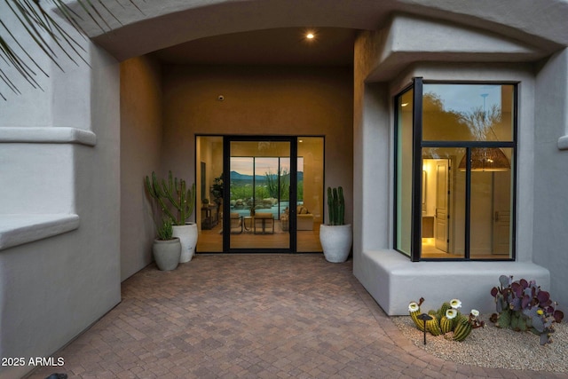 entrance to property with a patio