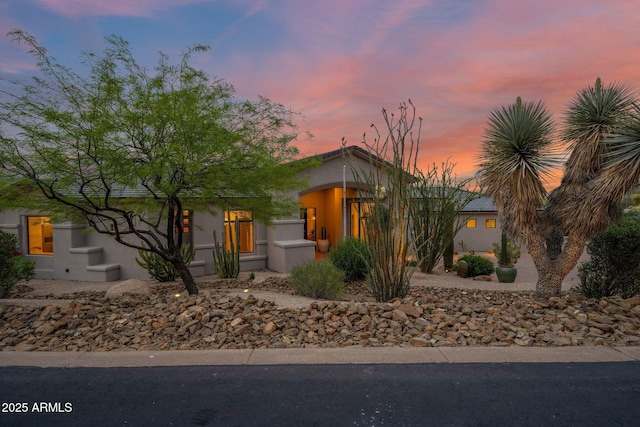 view of front of home featuring stucco siding