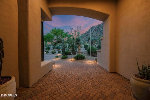 view of patio terrace at dusk