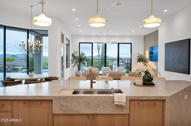 kitchen with recessed lighting, open floor plan, visible vents, and pendant lighting